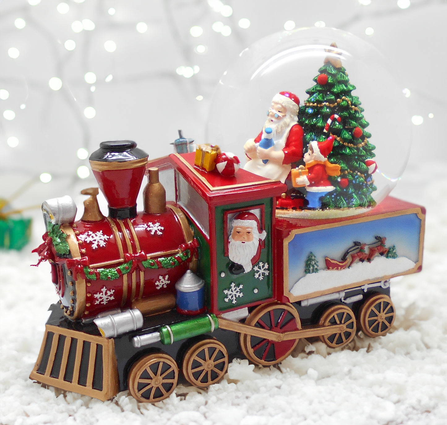 Schneekugel auf einer Eisenbahn mit Musik