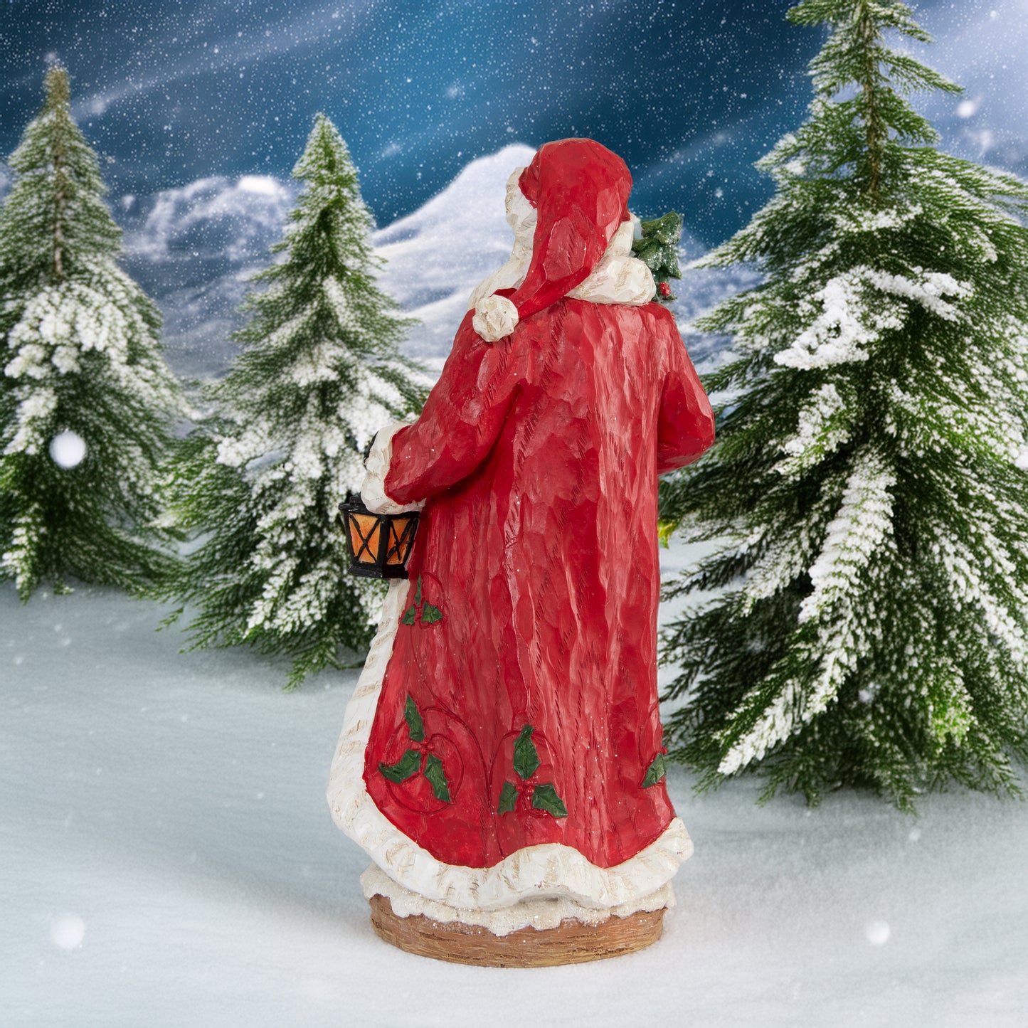 Weihnachtsmann mit Laterne und Weihnachtsbaum