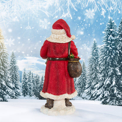 Weihnachtsmann mit Gehstock und Geschenken