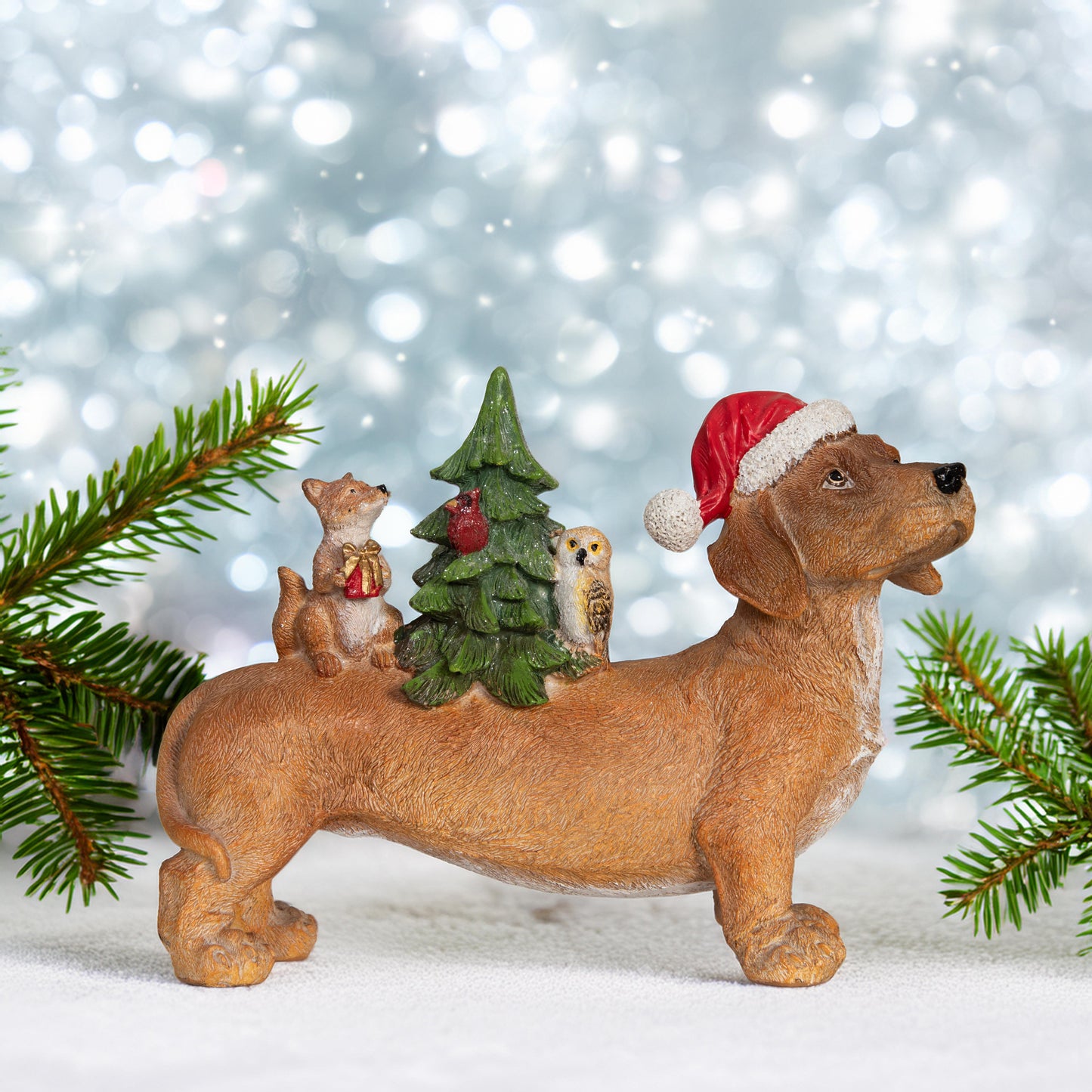 Dackel mit kleiner Waldszene auf dem Rücken